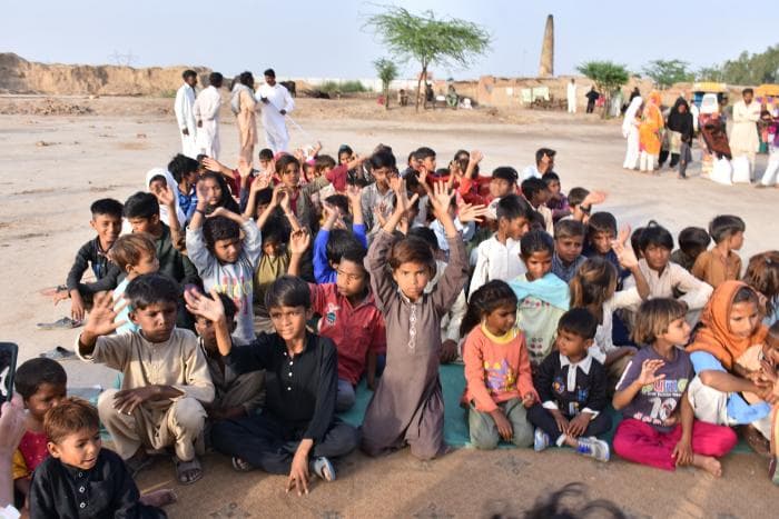 Young man holding toys for children - image 2