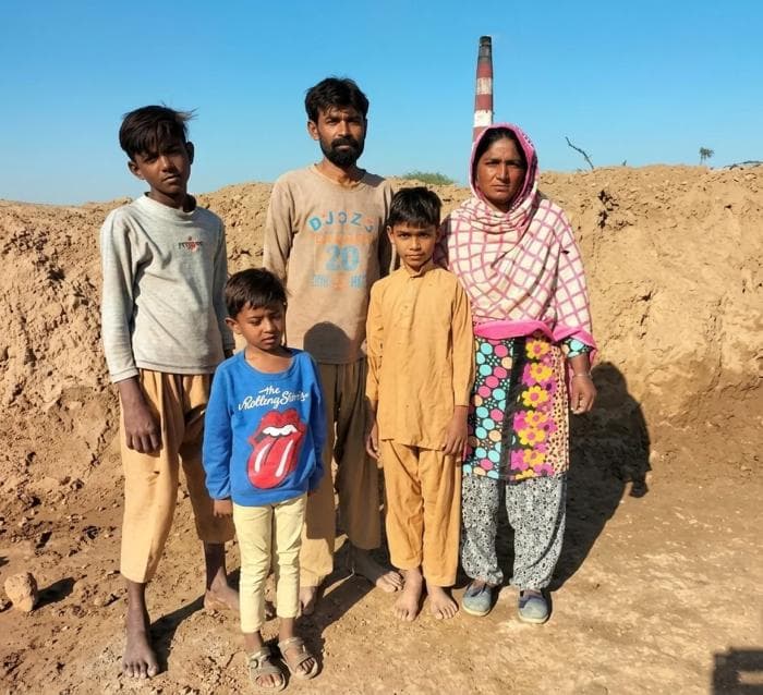 Family standing together - image 1